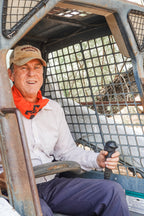 person wearing multi tool triangular bandage around their neck